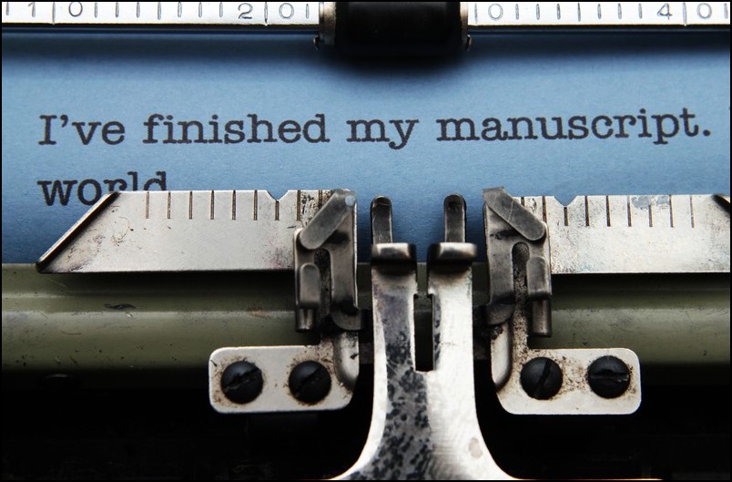 A typewriter with the words "I've finished my manuscript" typed